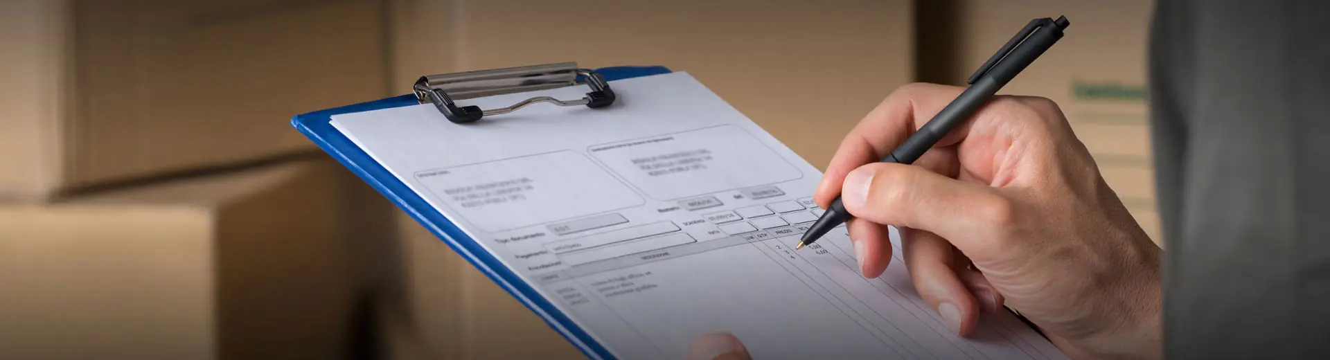Direct Right worker reviewing a shipments paperwork